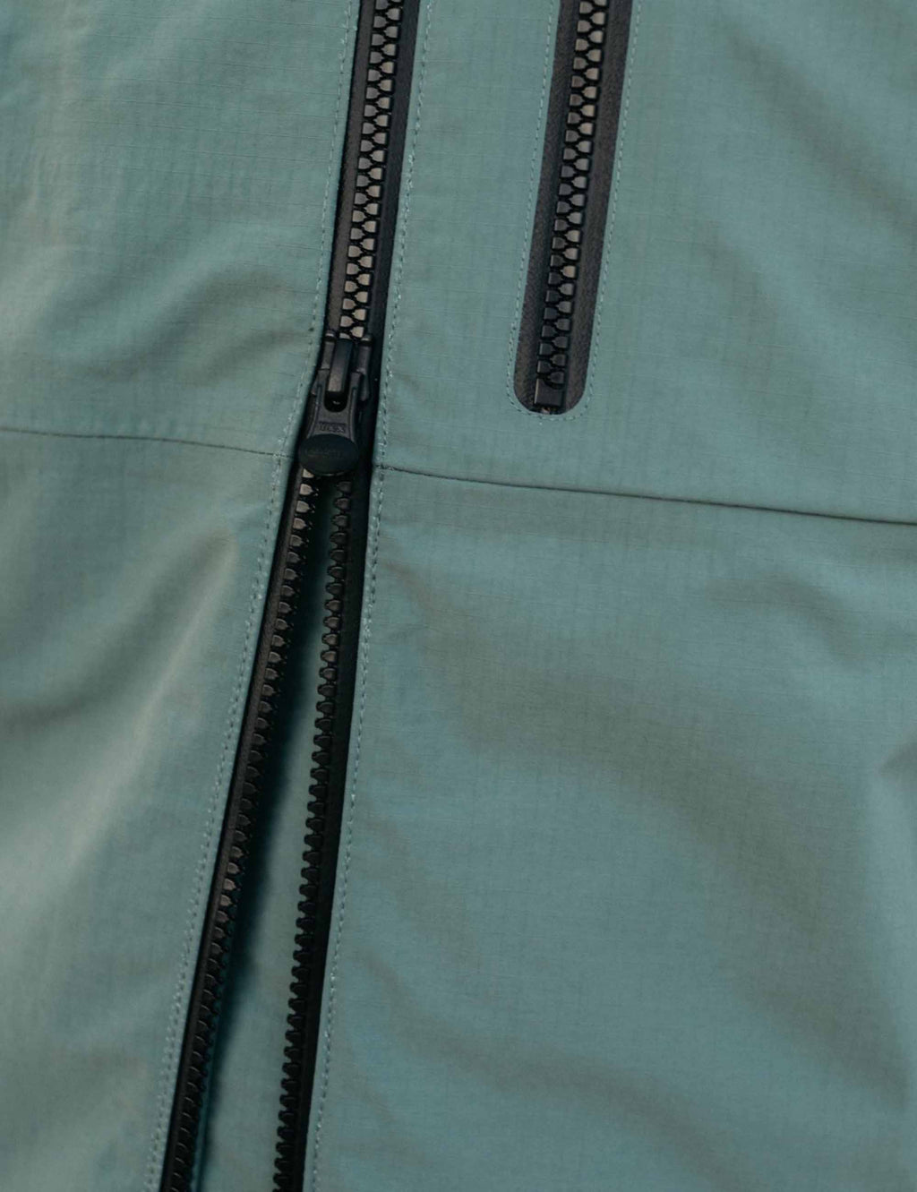 Finisterre Stormbird Waterproof Jacket in Deep Sea, side view