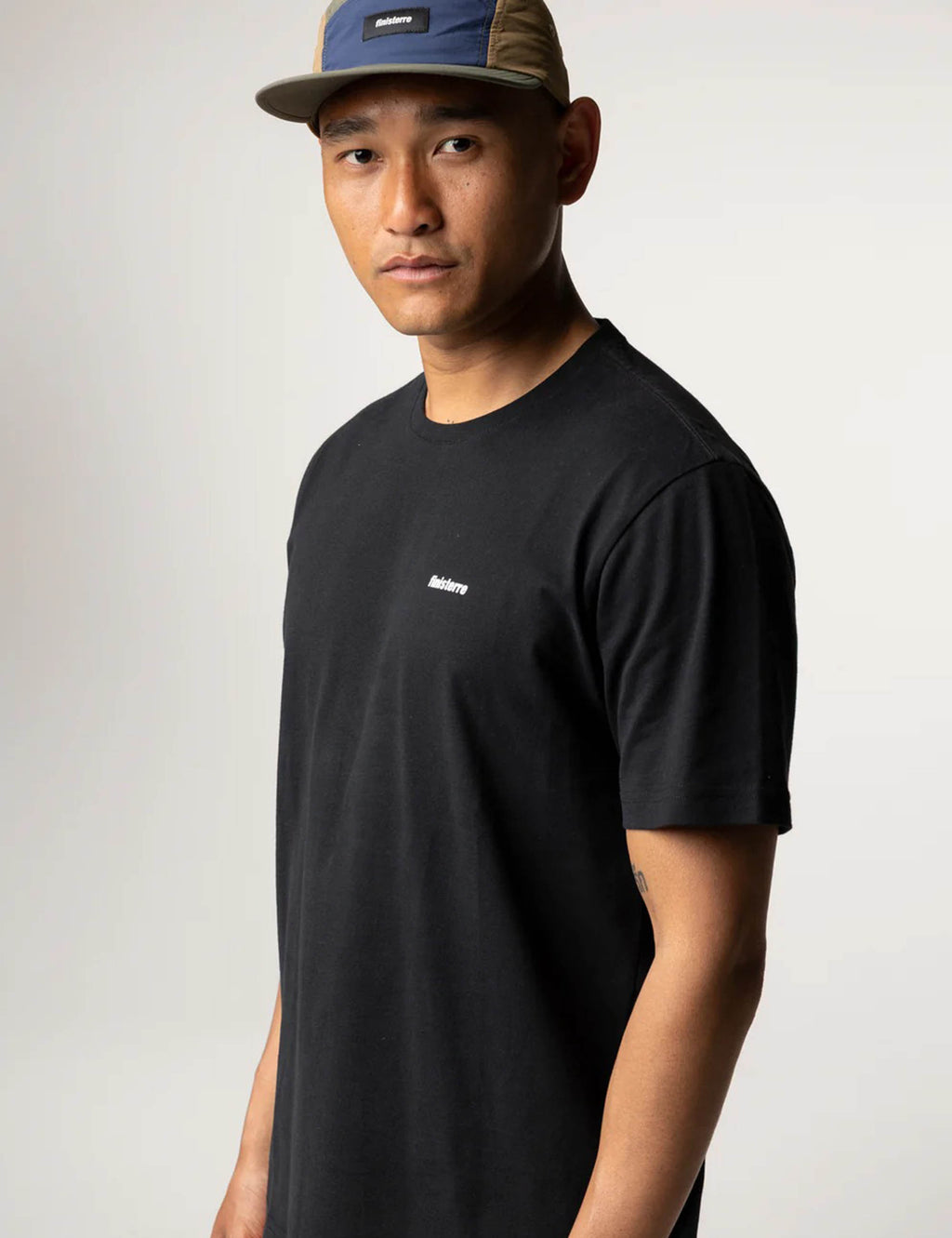 Finisterre Harlyn Logo Short Sleeve T-Shirt in Black, worn view