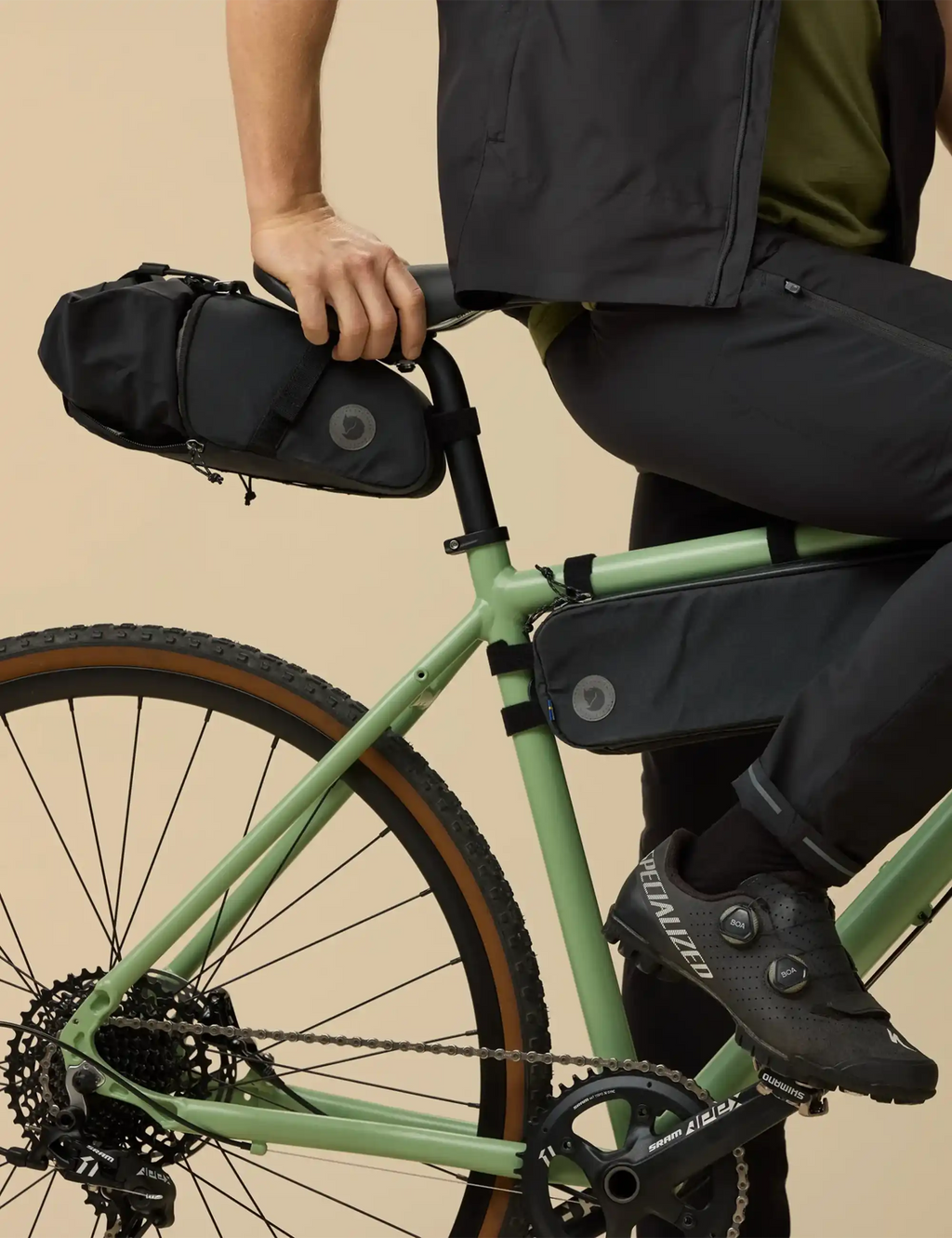 Black waterproof seat dry bag with top handle and mounting strap on bike