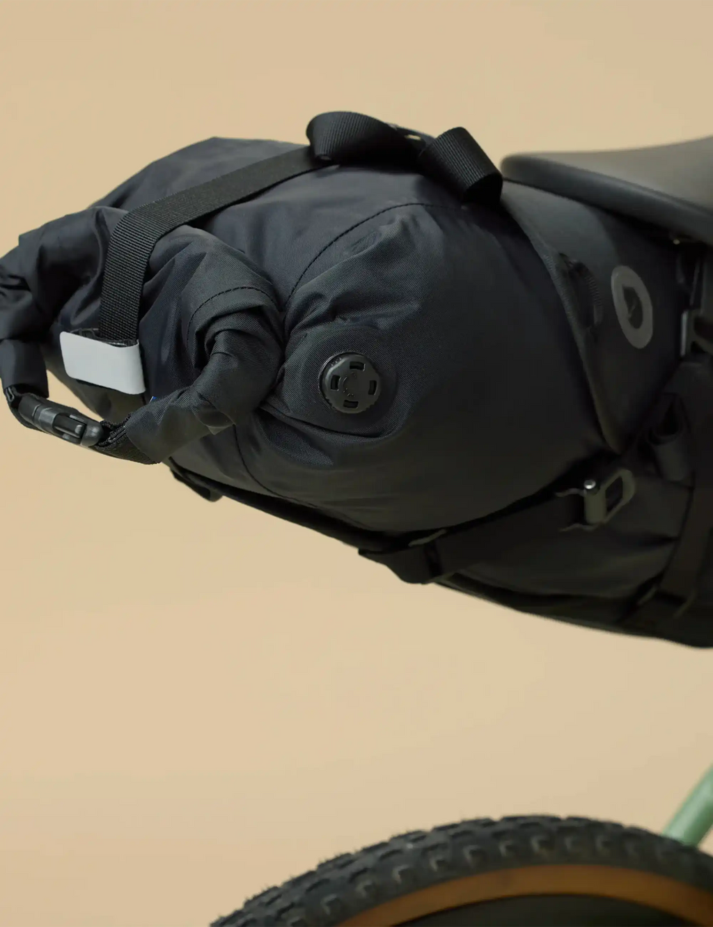 Black drybag cap area with round seal patch and webbing strap