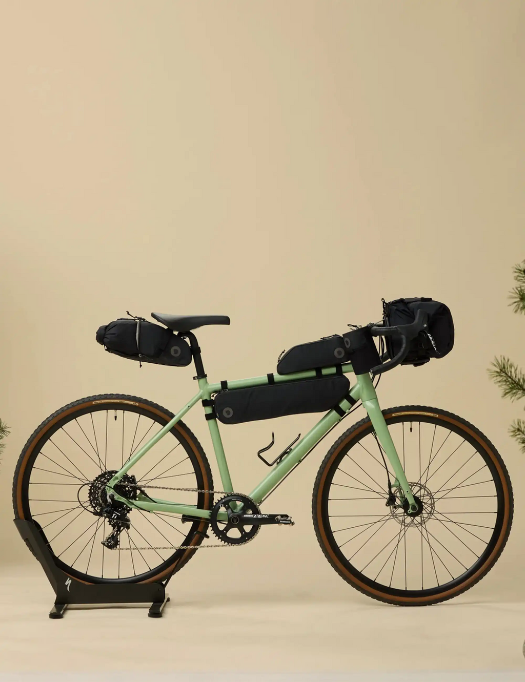 Black bike seat bag mounted on a green bicycle frame