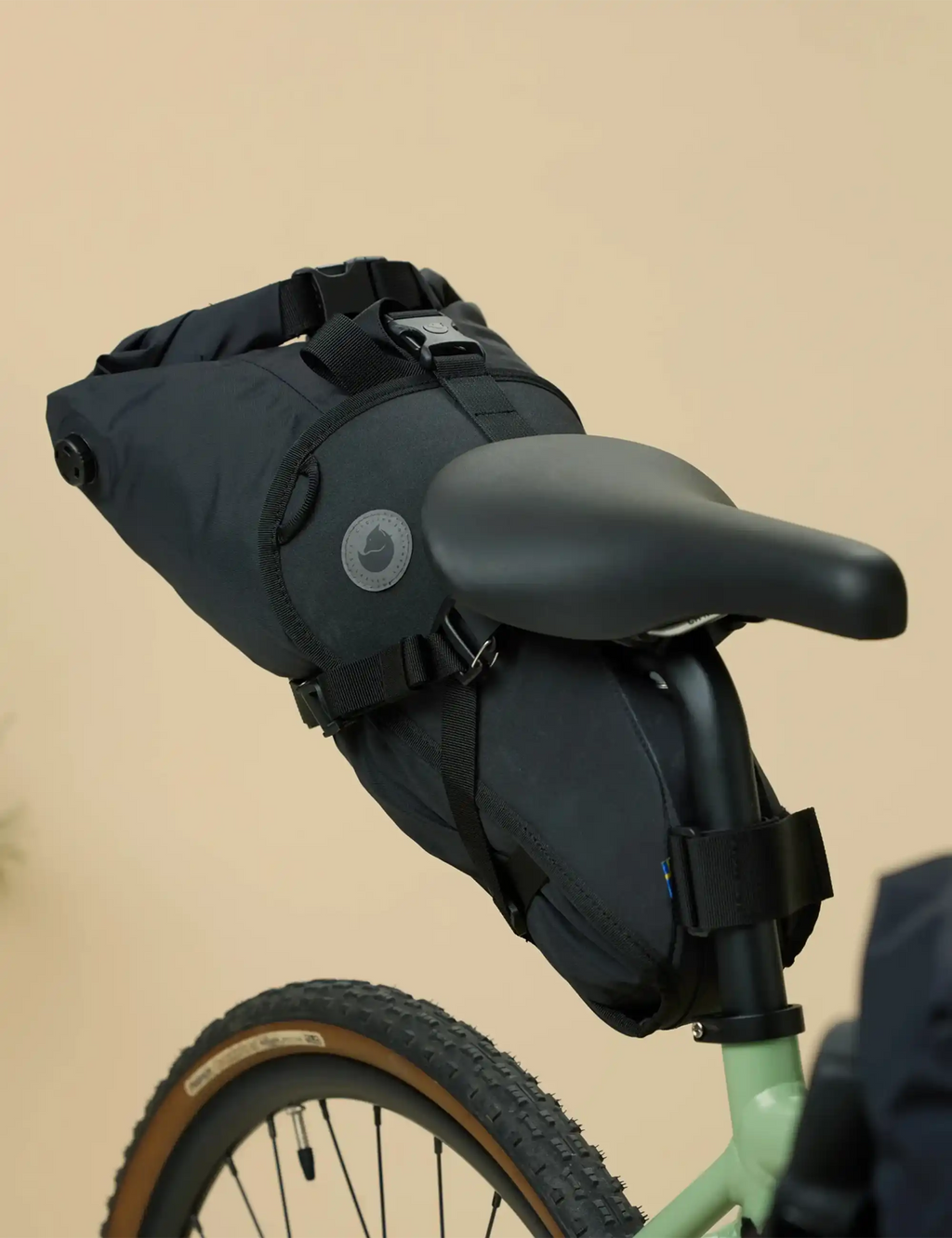 Dark seatbag harness with padded support and multiple attachment straps