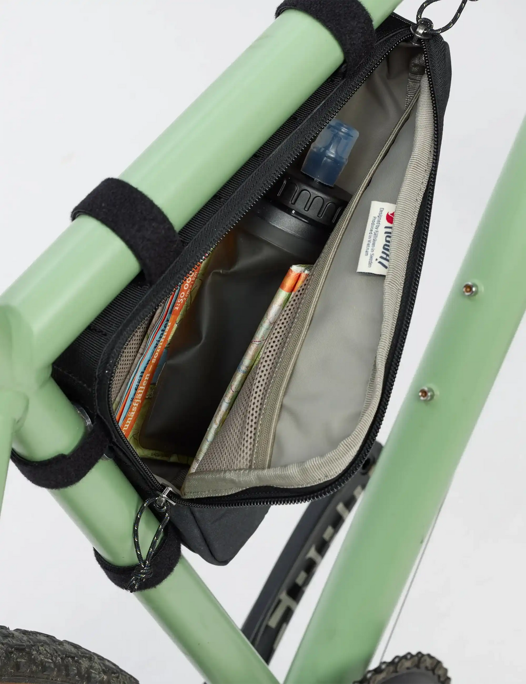Black triangle frame bag open interior with mesh pocket and zipper