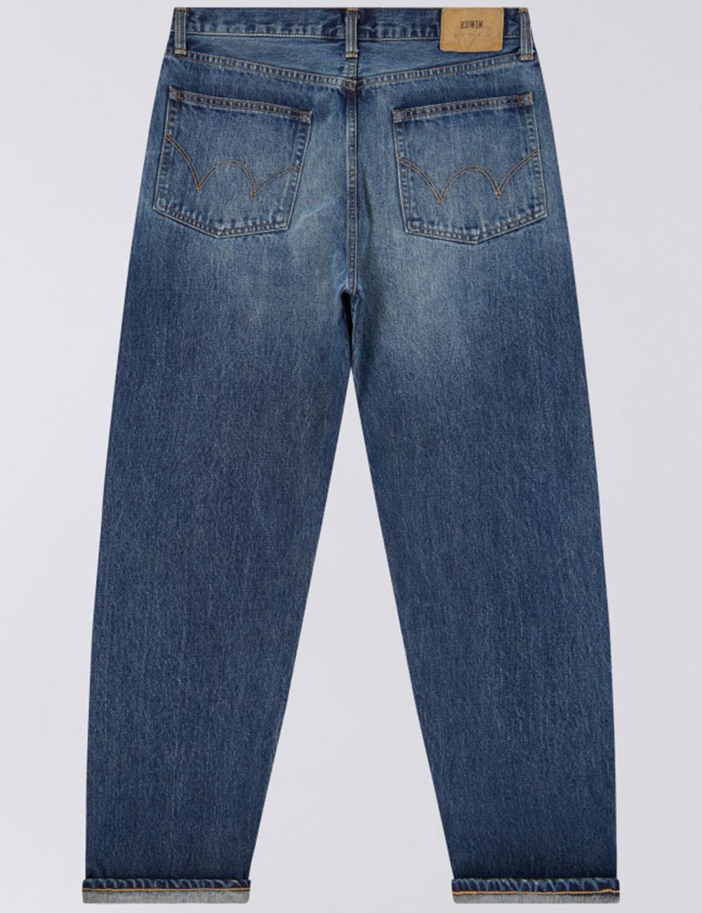 Loose dark blue denim jeans, back view with flapped pockets and contrast stitching