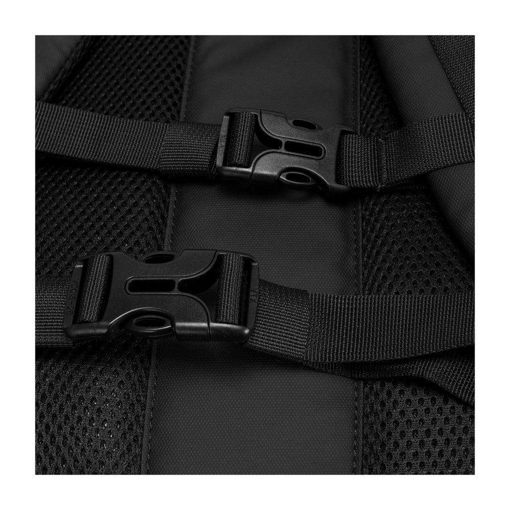 Black padded shoulder straps with plastic buckles and mounting hardware close-up