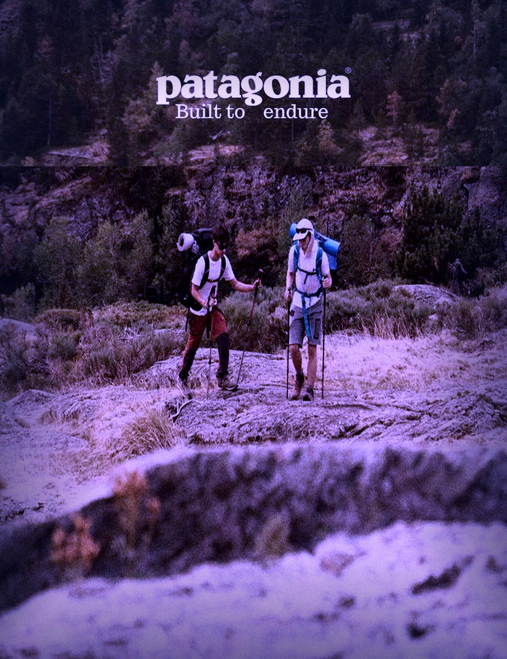Patagonia — two hikers with loaded backpacks on a mountain trail
