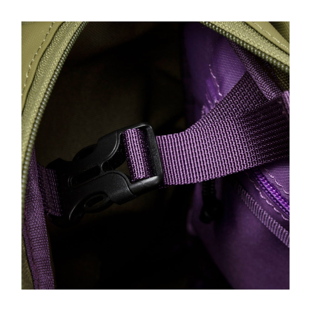 Inside view of khaki tote backpack with purple webbing strap and plastic buckle