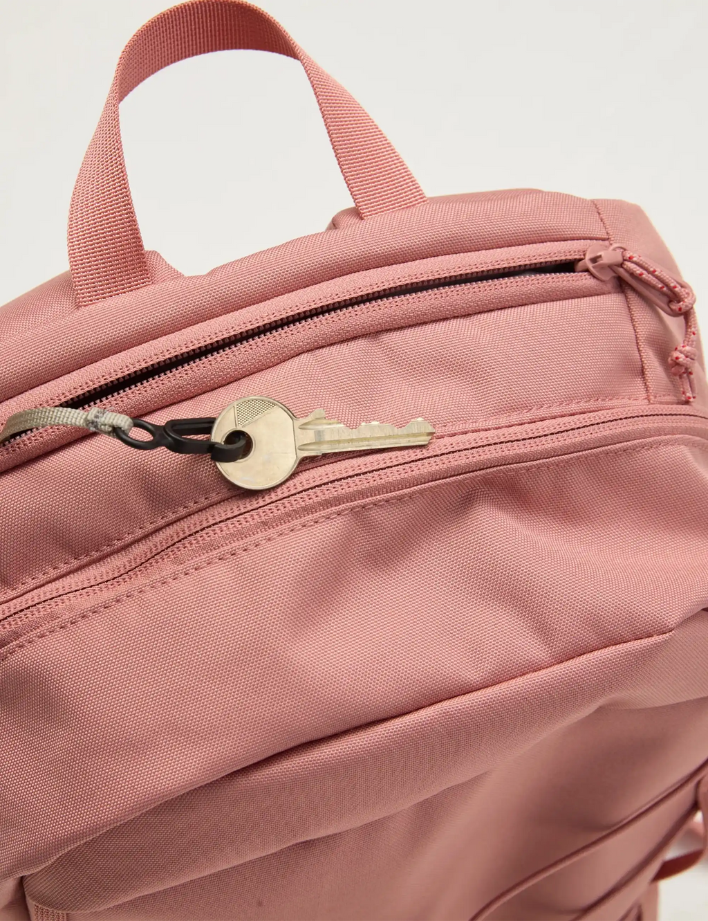 Dusty rose backpack zipper pocket with metal zipper pull and small front flap
