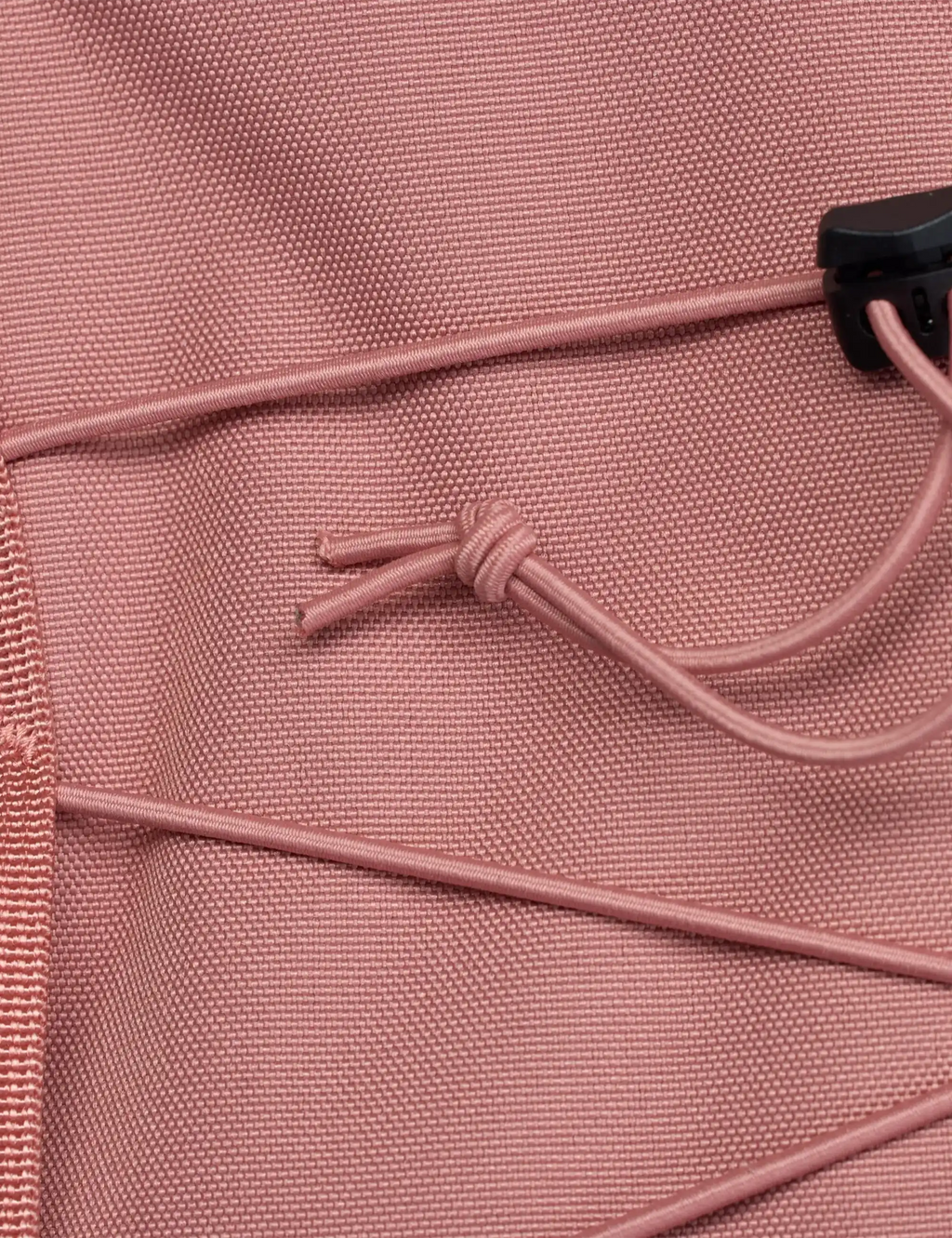 Dusty rose backpack front with cord-tie detail and textured fabric
