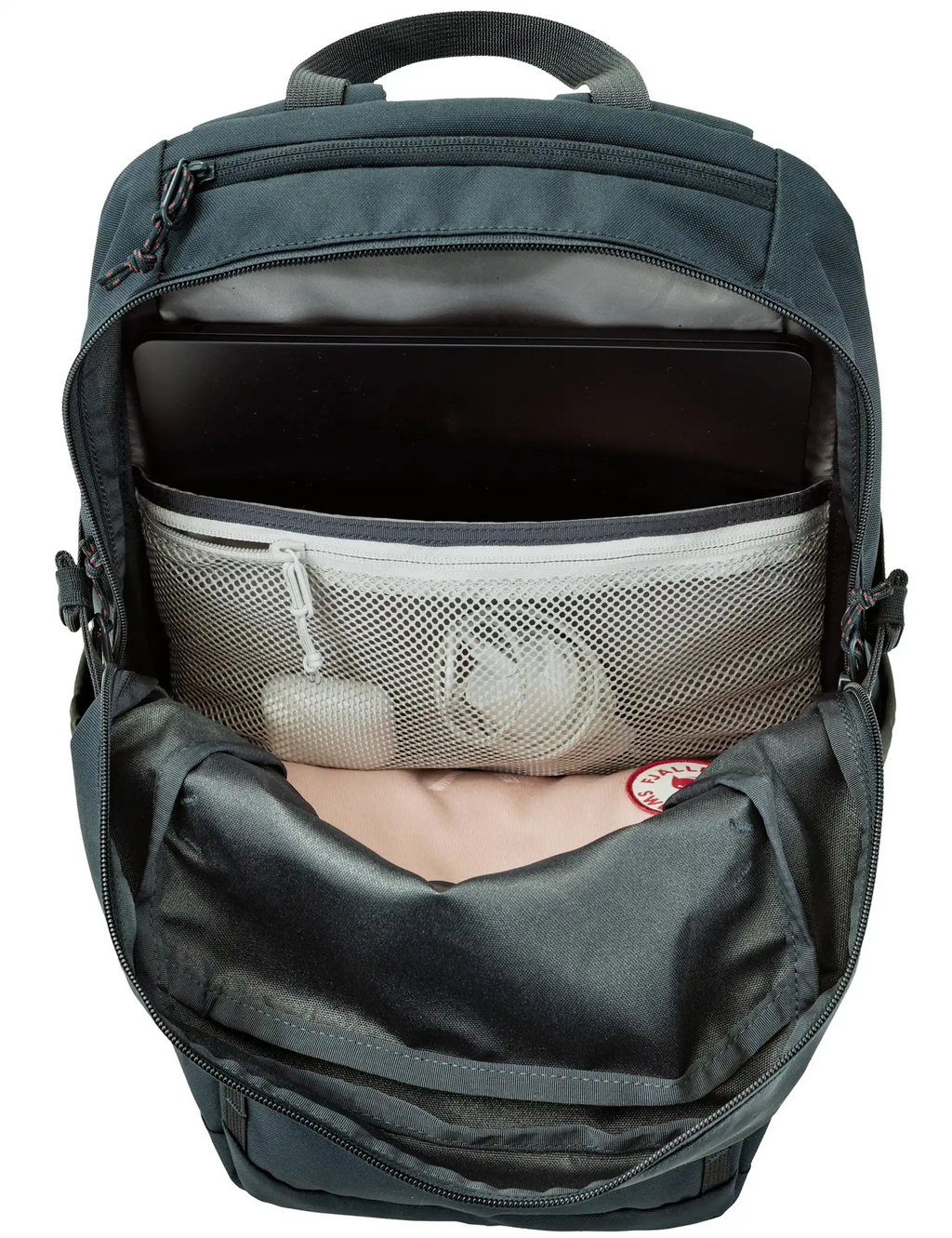 Dark navy backpack interior with padded laptop sleeve and mesh pocket visible