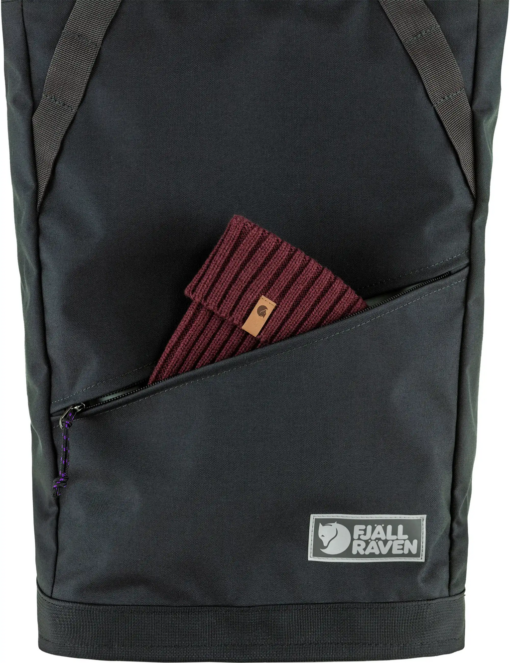 Coal black backpack front pocket zipper with maroon knit item inside